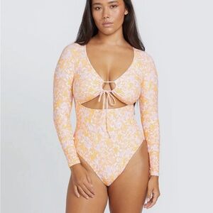 NWT Volcom women’s Coco Surf suit, long sleeve one piece. Orange floral. Melon.